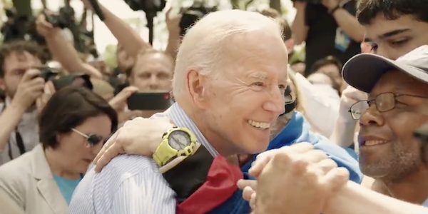 Joe Biden hugging a supporter at a rally
