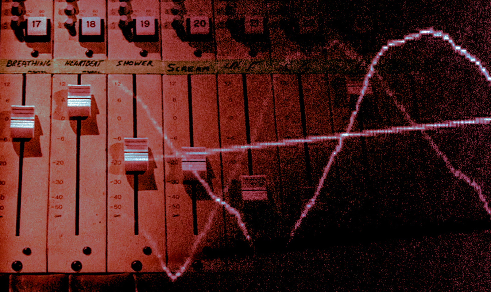 Red sound waves emit frequencies against an electronic sound board