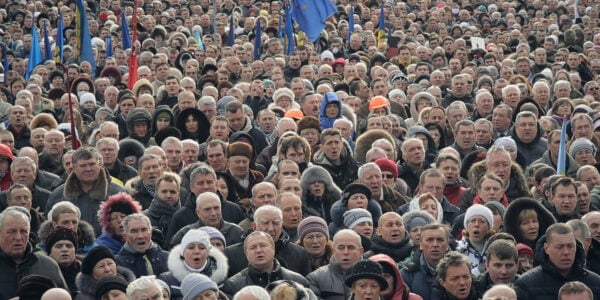 a sea of faces all turned toward the camera at Maidan in Kyiv